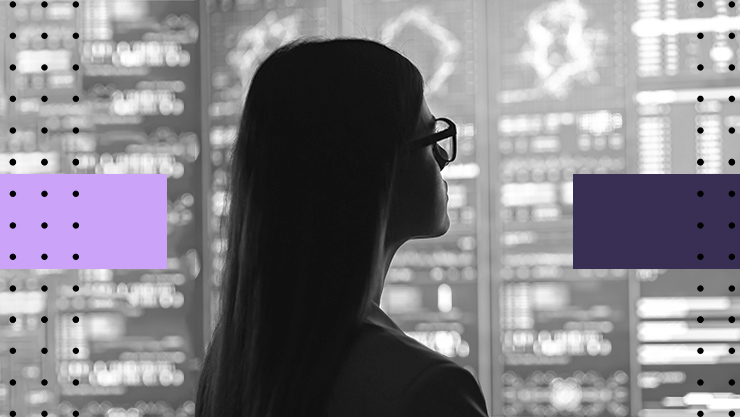 A woman looking at a digital display