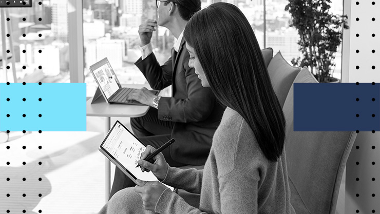 People in an office working on tablets