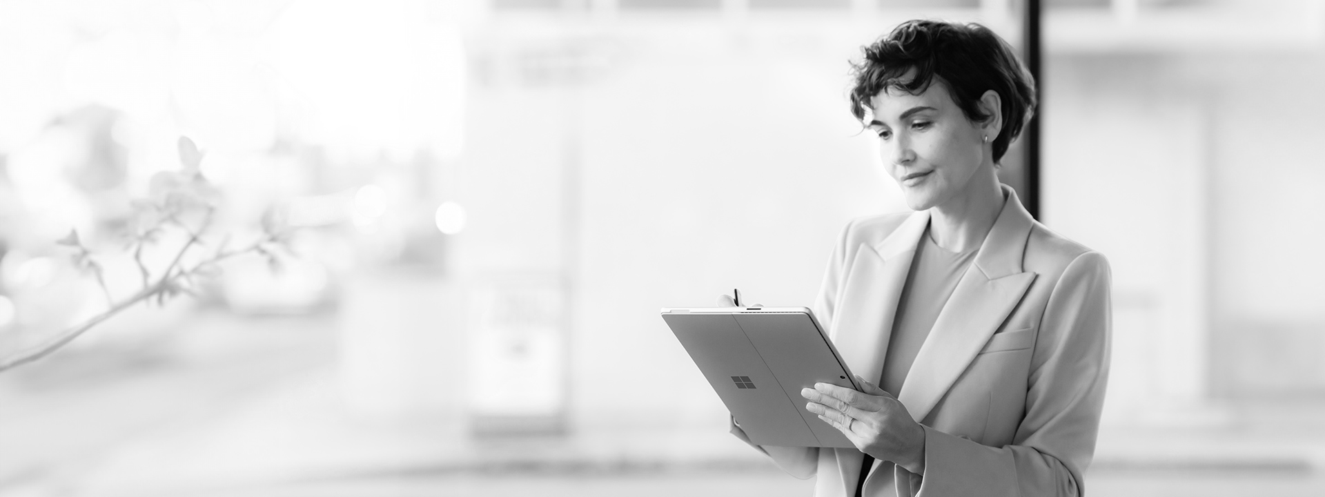 A woman working on her tablet