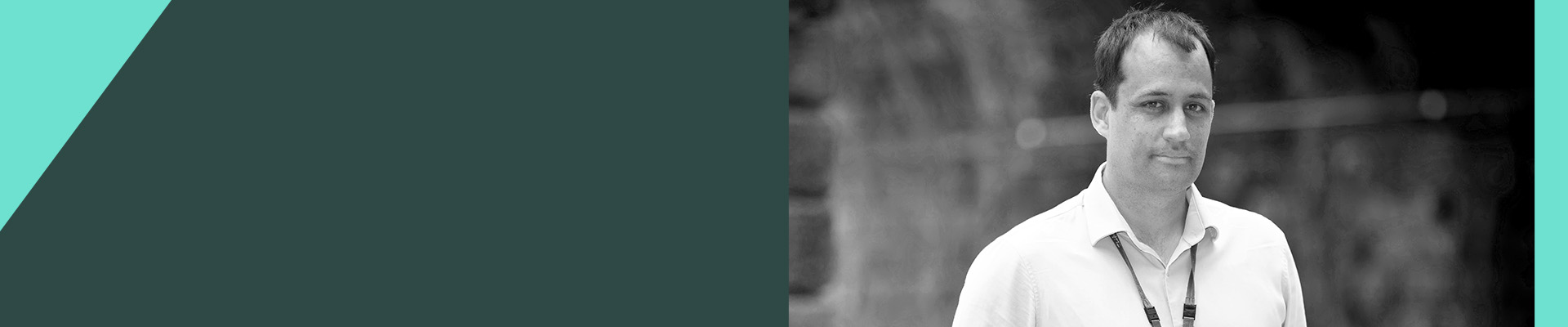 A man with a lanyard around his neck