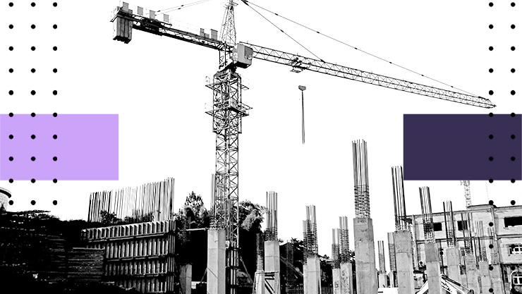 Construction site with a tall crane above concrete columns and exposed rebar in a black‑and‑white scene.